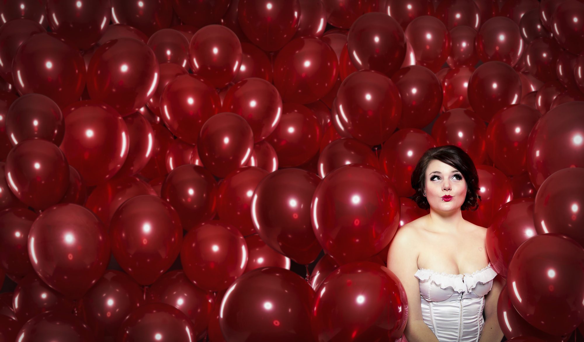 10. Surrounded By Balloons